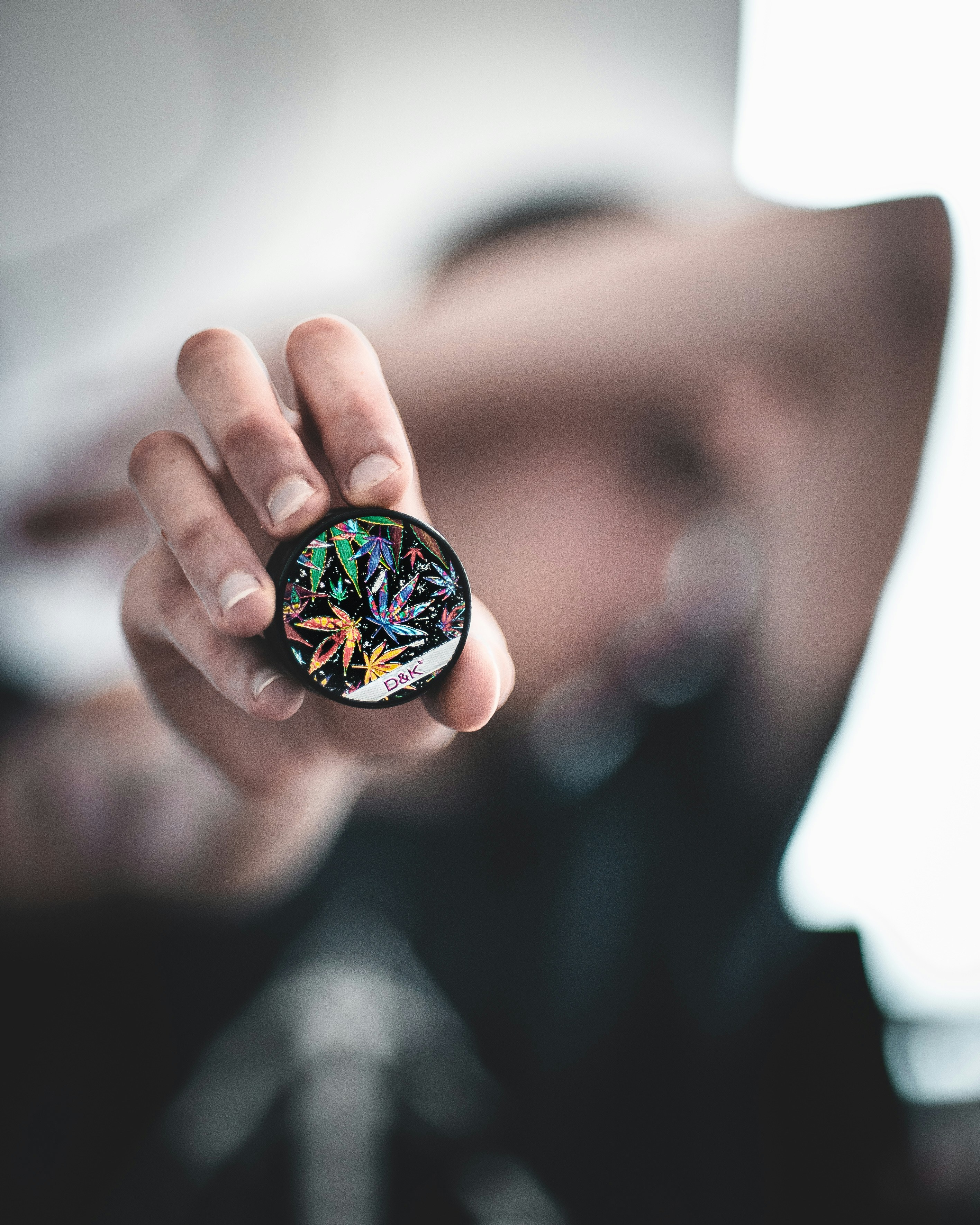 person holding round case