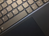 Close-up view of a laptop keyboard highlighting several keys, including Ctrl, Alt, and arrow keys, along with a portion of the touchpad.