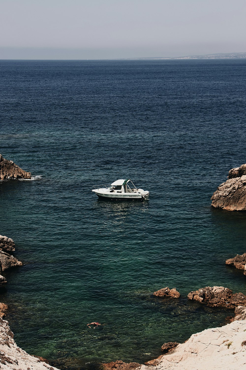 aerial photography white boat on body of water