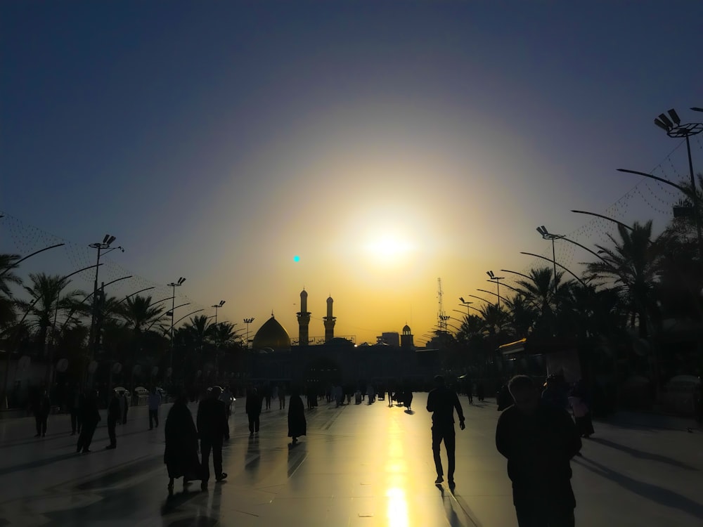 people walking towards mosque