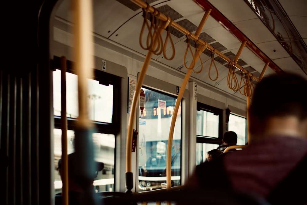 people inside train during daytime