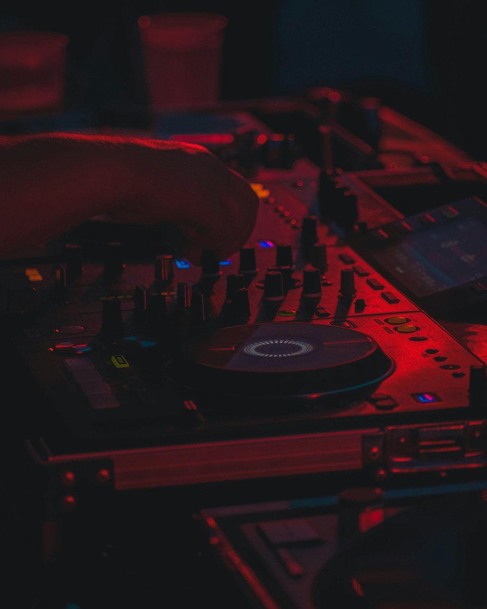 man standing beside DJ controller