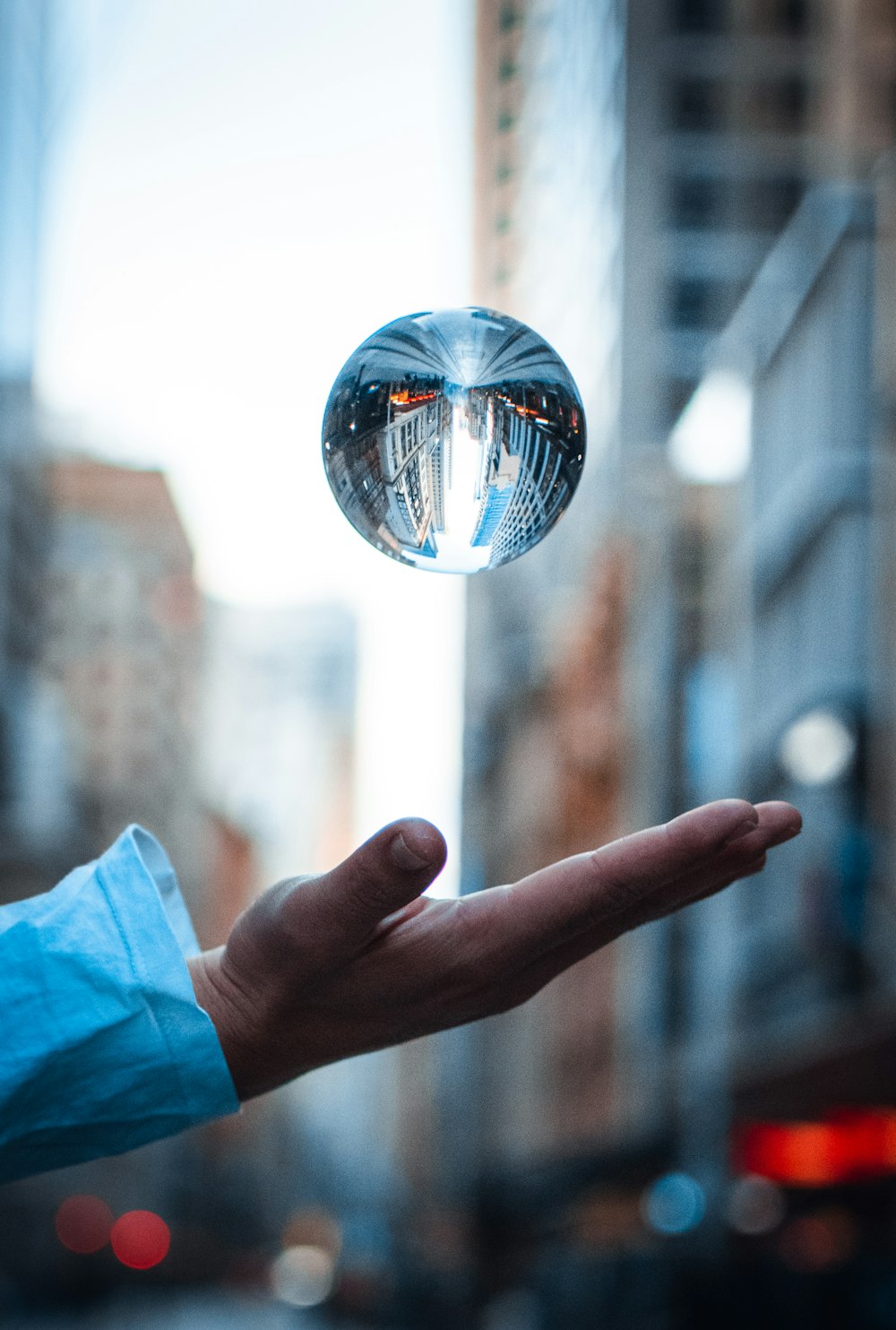 ball photography above human hand