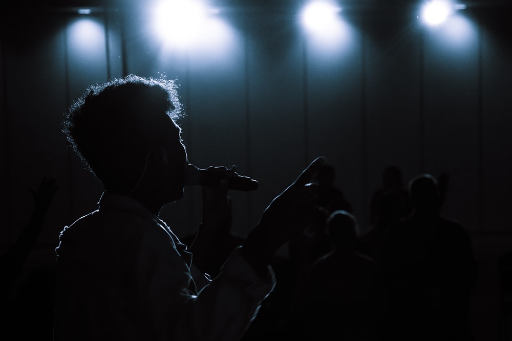 man singing using microphone