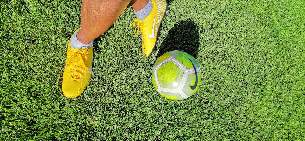 green and white Nike soccer ball