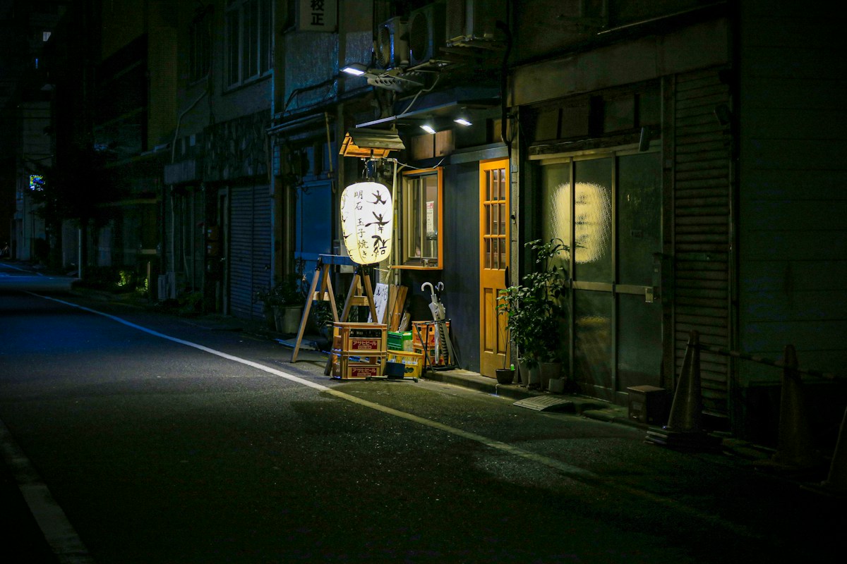 Small Japanese eatery storefront with paper lanterns