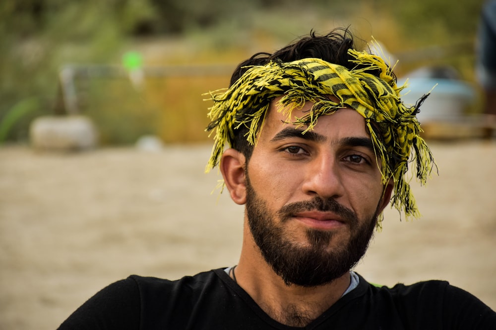 man wearing yellow and black headband