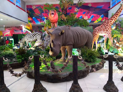 A vibrant display of life-size urban culture models arranged in a gallery setting.