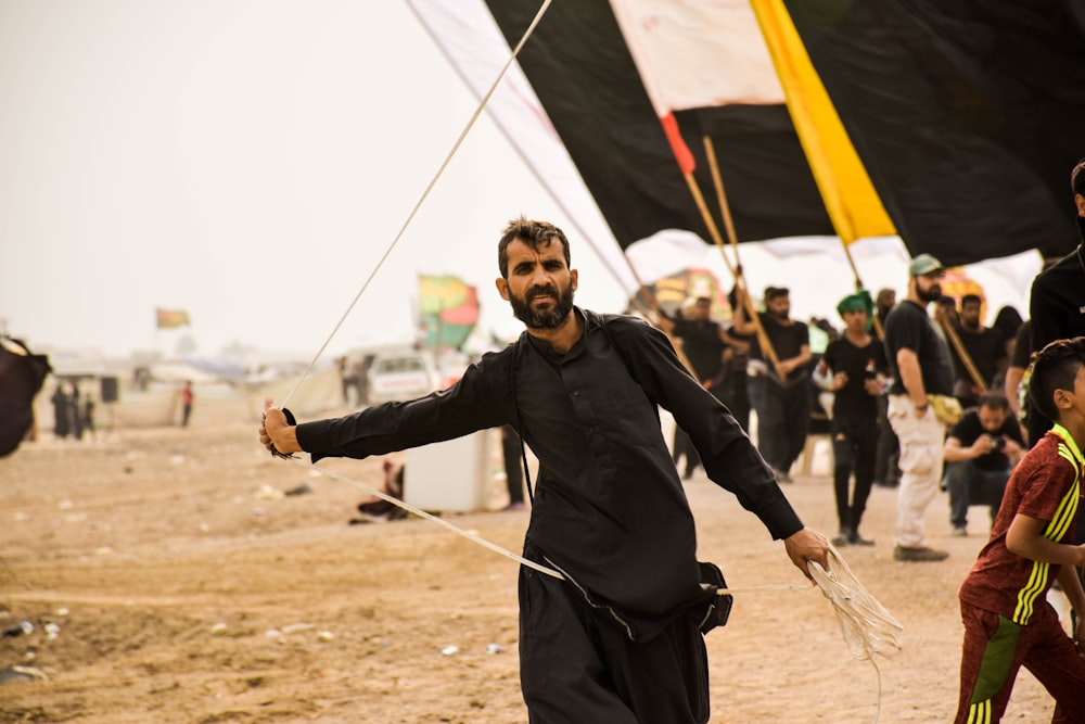 man wearing black thobe dress