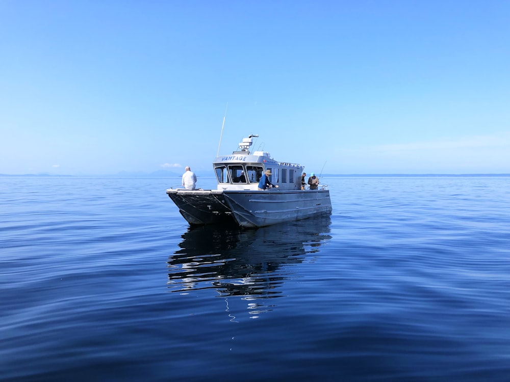 white motorboat on water