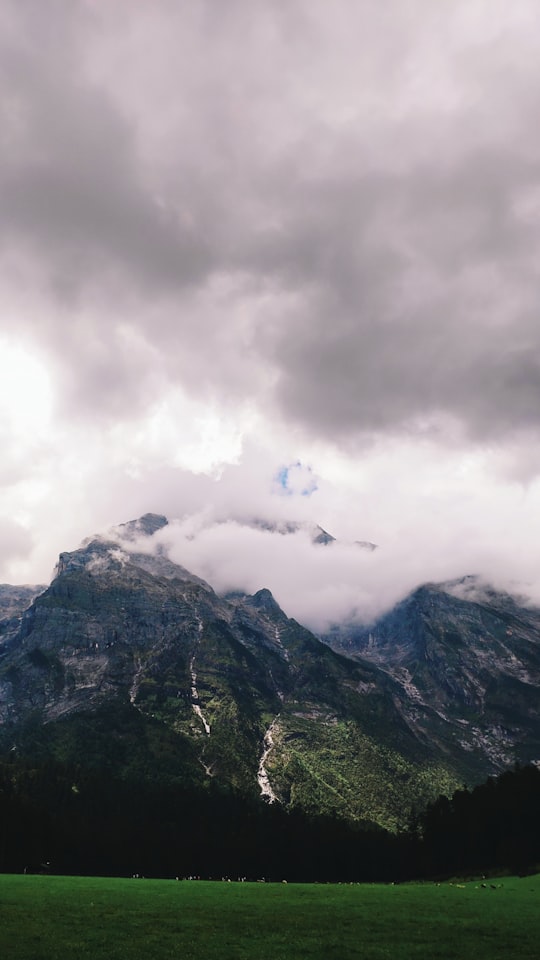 brown mountain during daytime in Jade Dragon Snow Mountain China