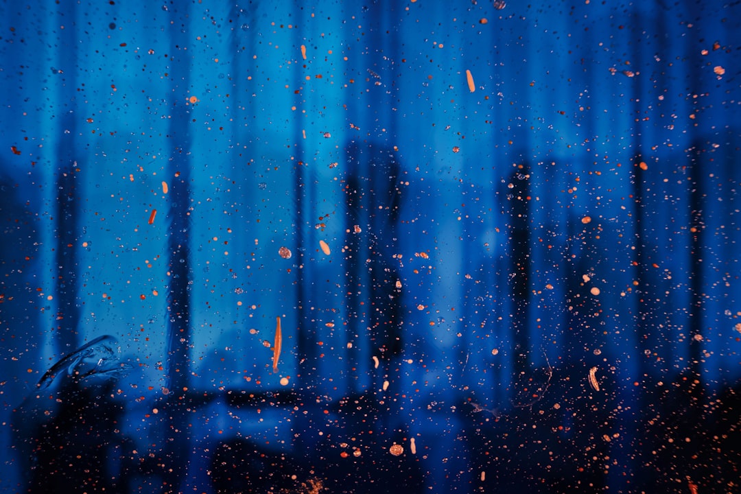 a window with rain drops on the glass, Deep Blue Theater