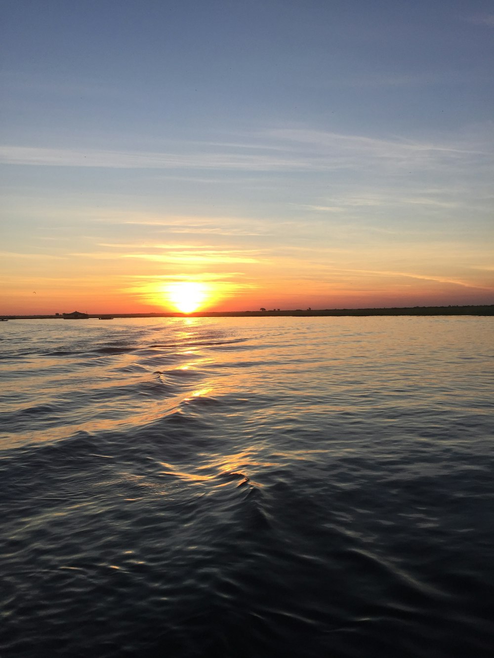 calm sea under blue sky