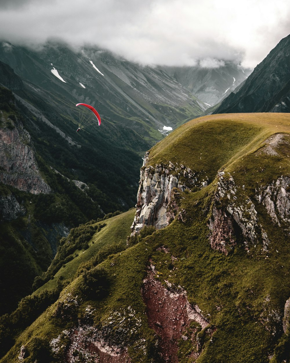 person paragliding during daytime