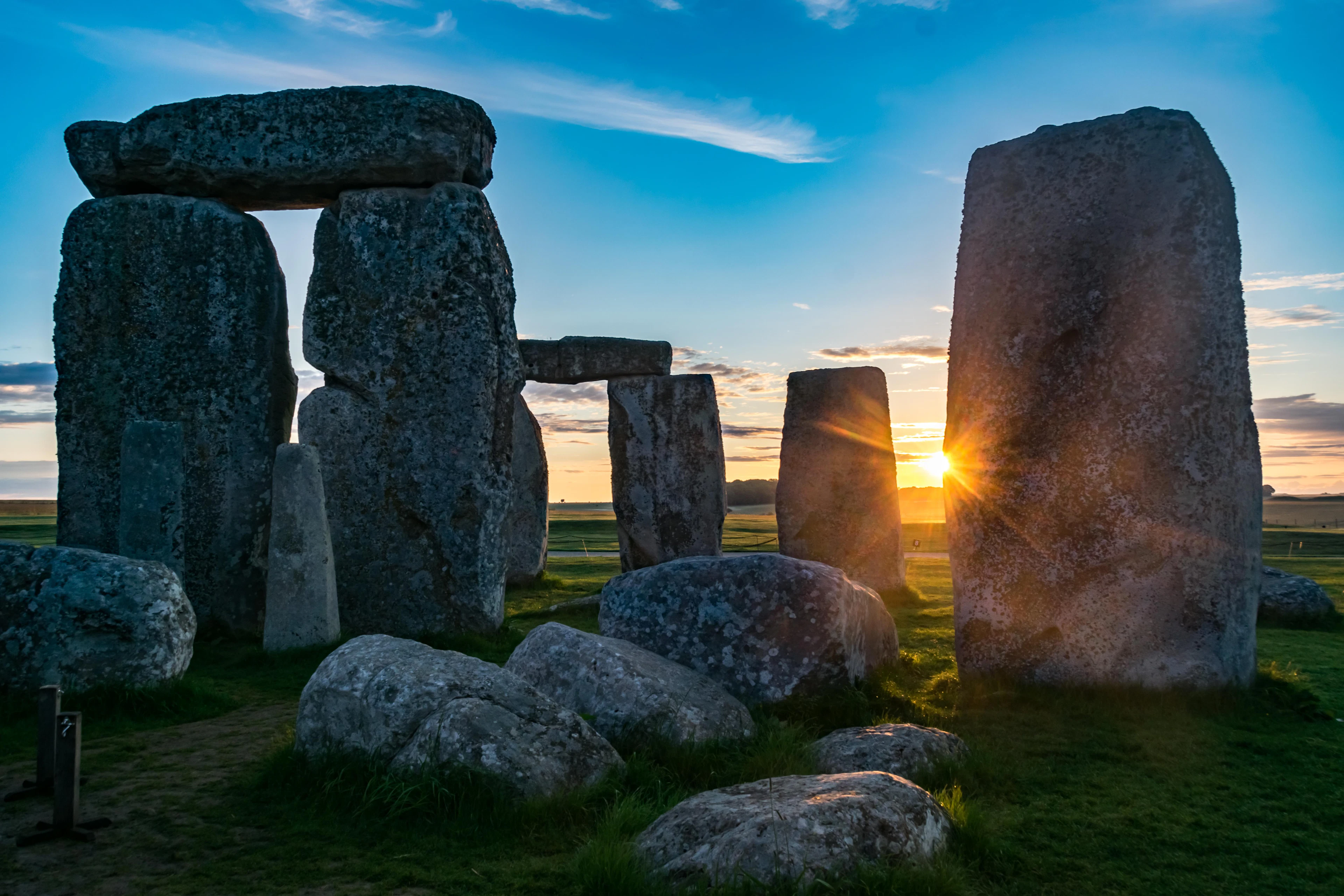 The sun setting behind Stonehenge