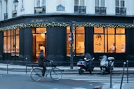 man riding bicycle near building