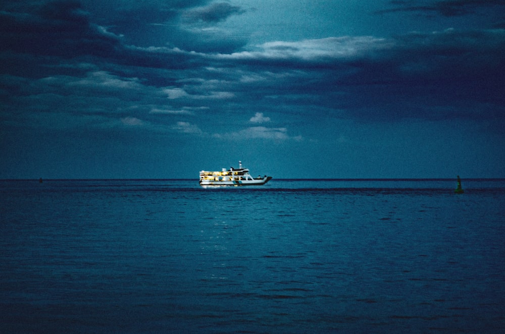 a large boat floating on top of a large body of water