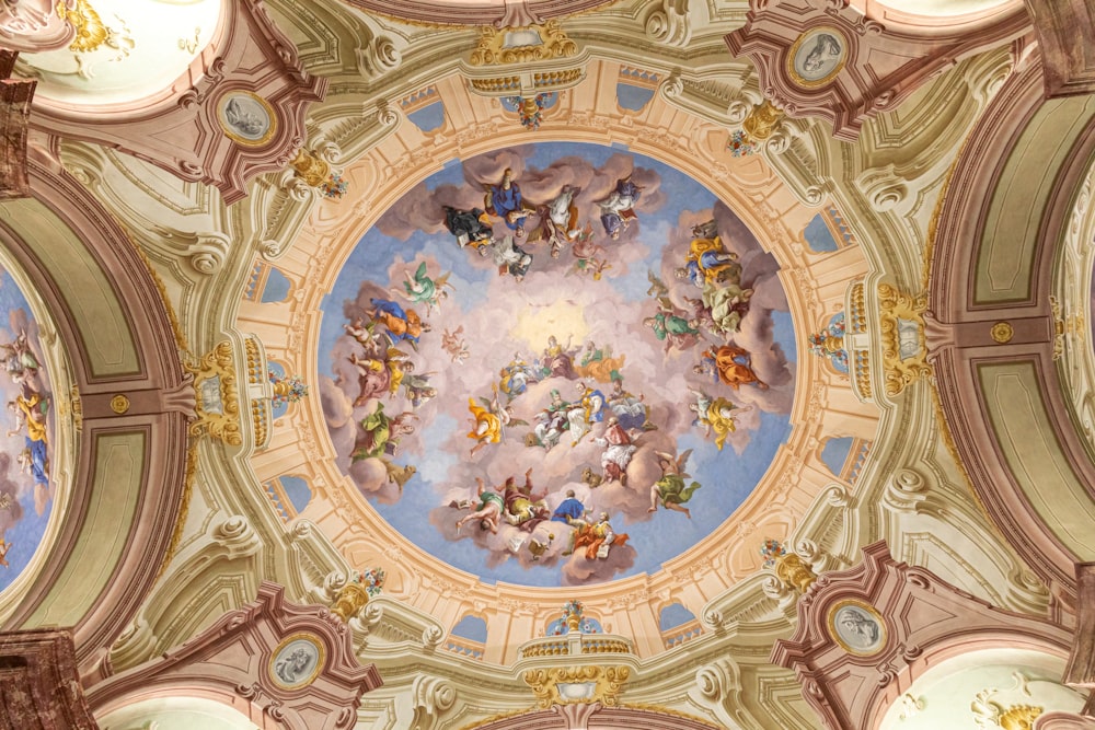 the ceiling of a building with a painting of angels on it