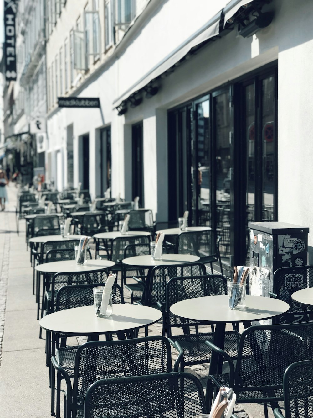 round white tables beside pavement