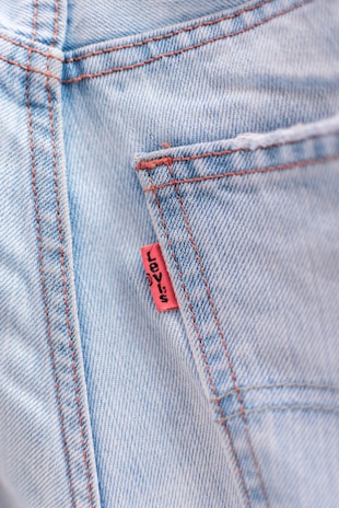 Close-up of custom tags on stylish apparel.