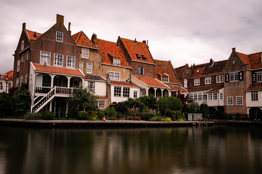 calm body of water and house