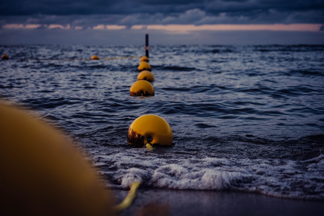 yellow balls on blue sea