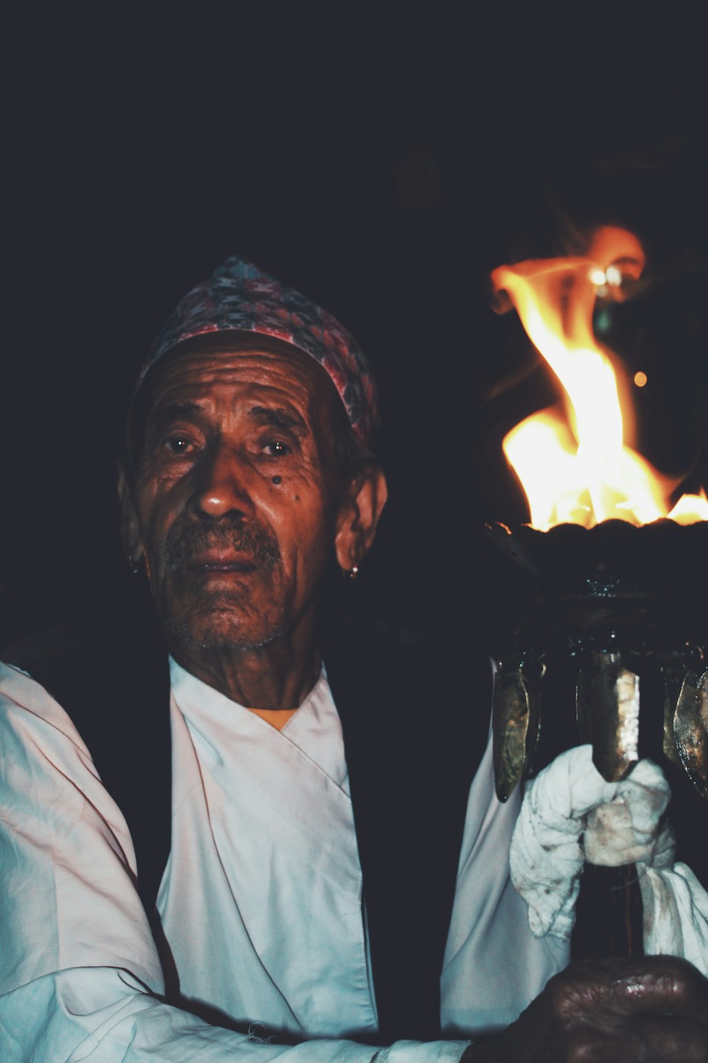 man sitting near torch