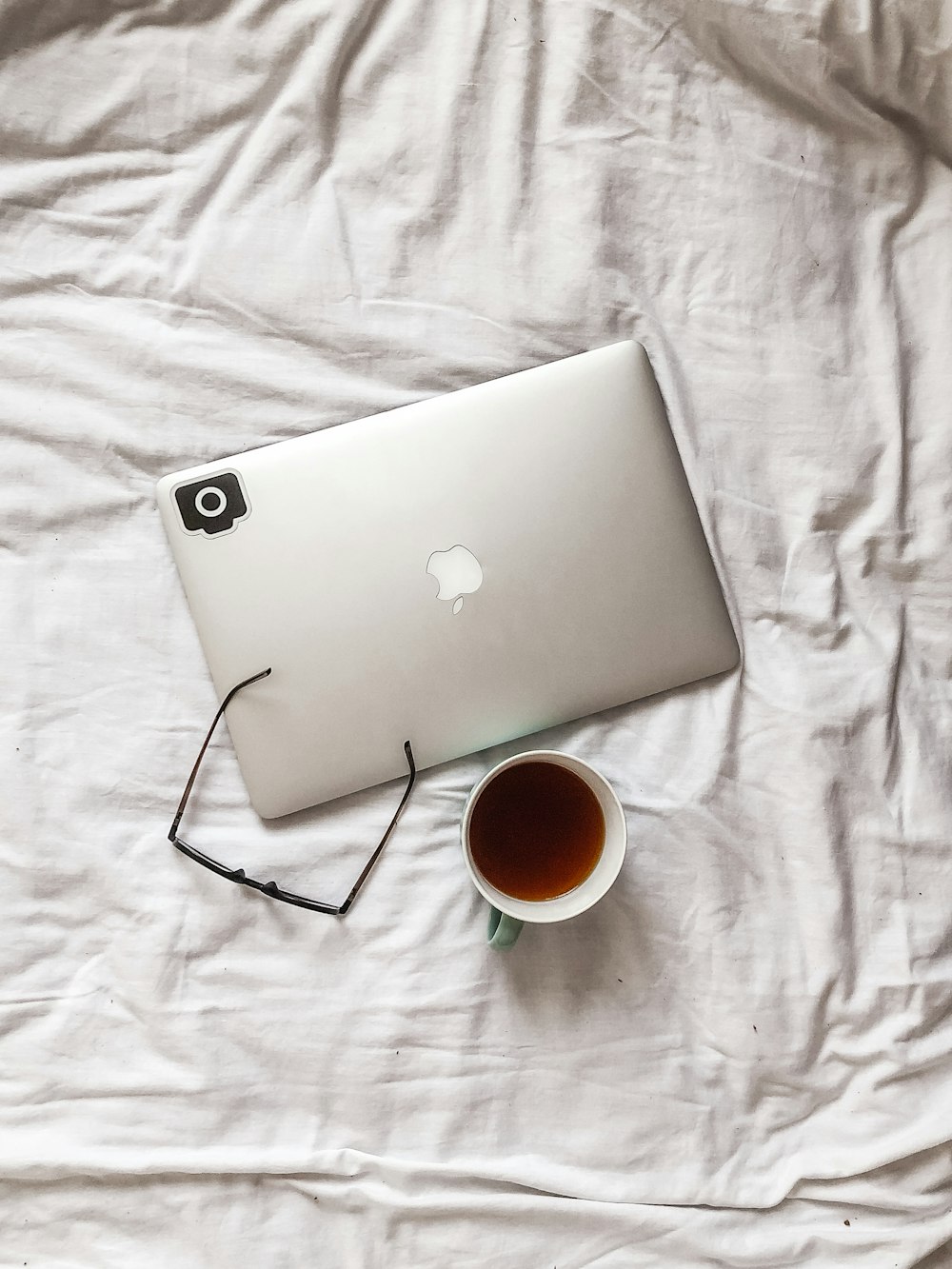 cup of coffee beside laptop