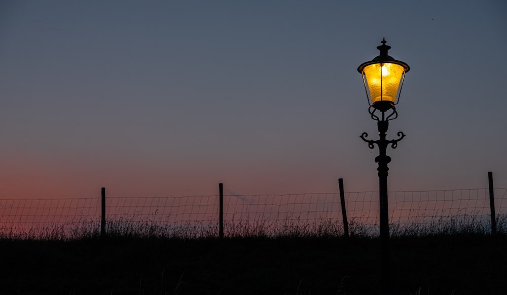 turned-on lamppost
