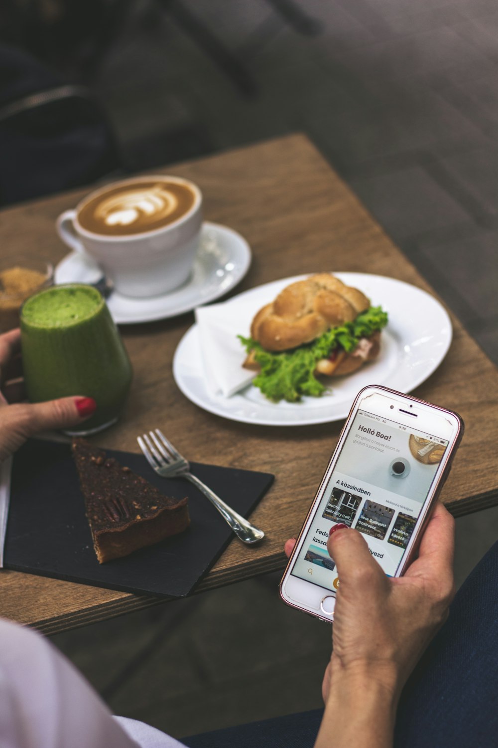 person using iPhone white eating