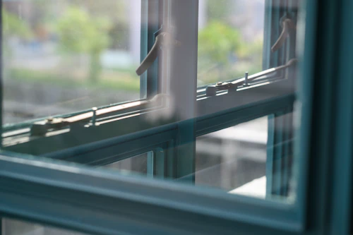 Grey metal-framed window, closed