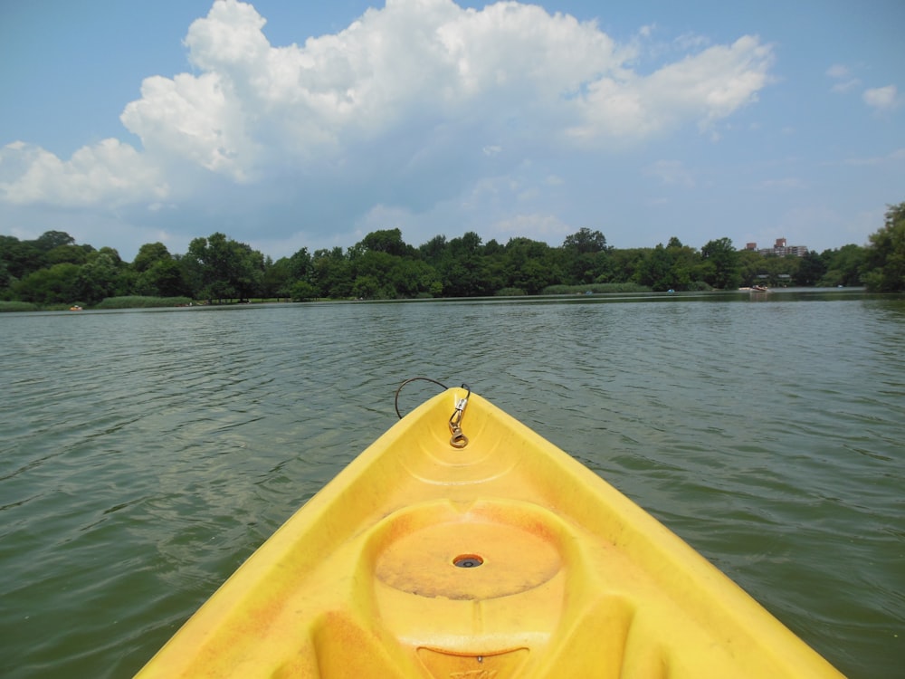 yellow plastic boat under clear blue sky