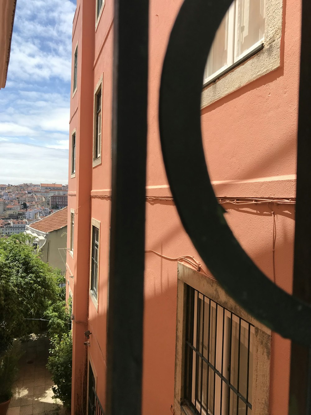 a view of a building through a gate