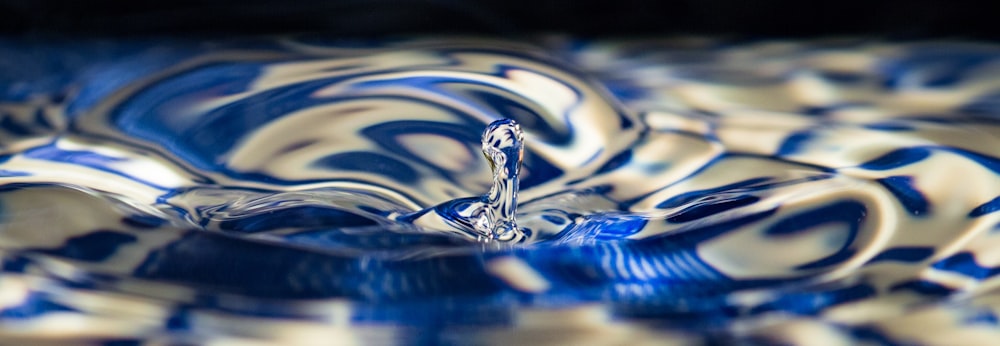 a close up of a blue and white bowl