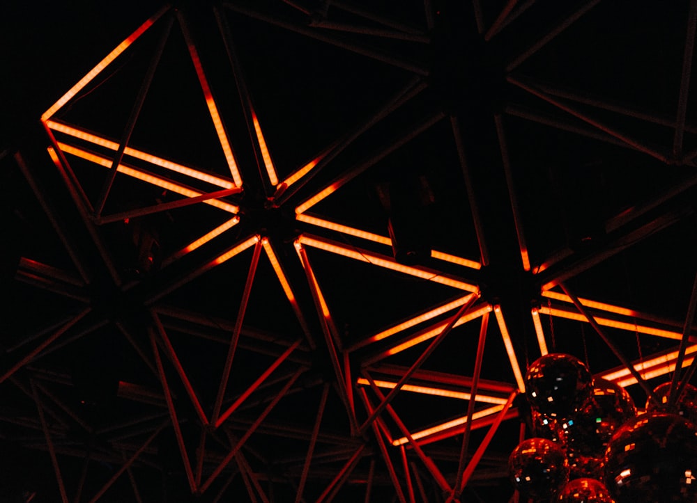 a close up of a light fixture in a dark room