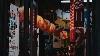 Softly lit hallway with warm ochre walls and traditional Thai art