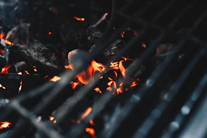 Close-up of the pyrolysis process equipment glowing with heat as biochar is produced.