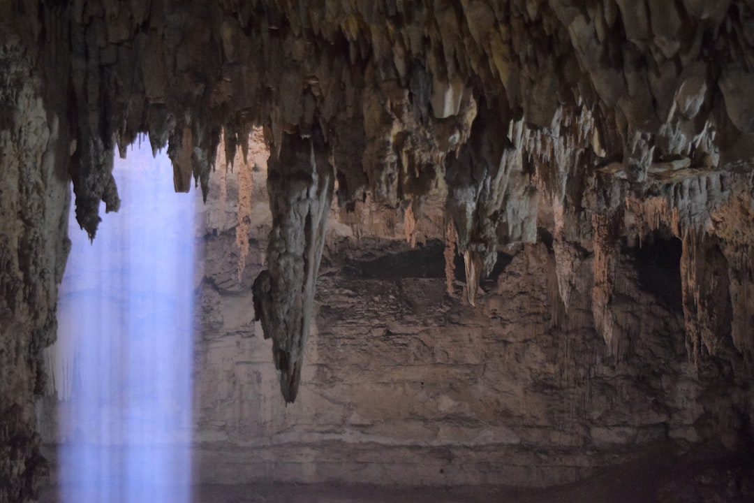 waterfalls, Cenote Suytun Valladolid in Yucatan, Mexico.<p></figure>This nice effect was created by the sunlight hitting the smoke in the dark room of the cenote.