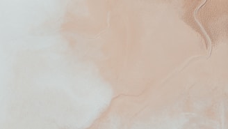 a white and beige background with a black and white design