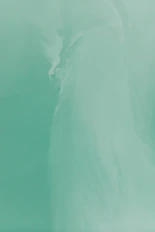 a man riding a surfboard on top of a wave