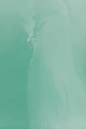 a man riding a surfboard on top of a wave