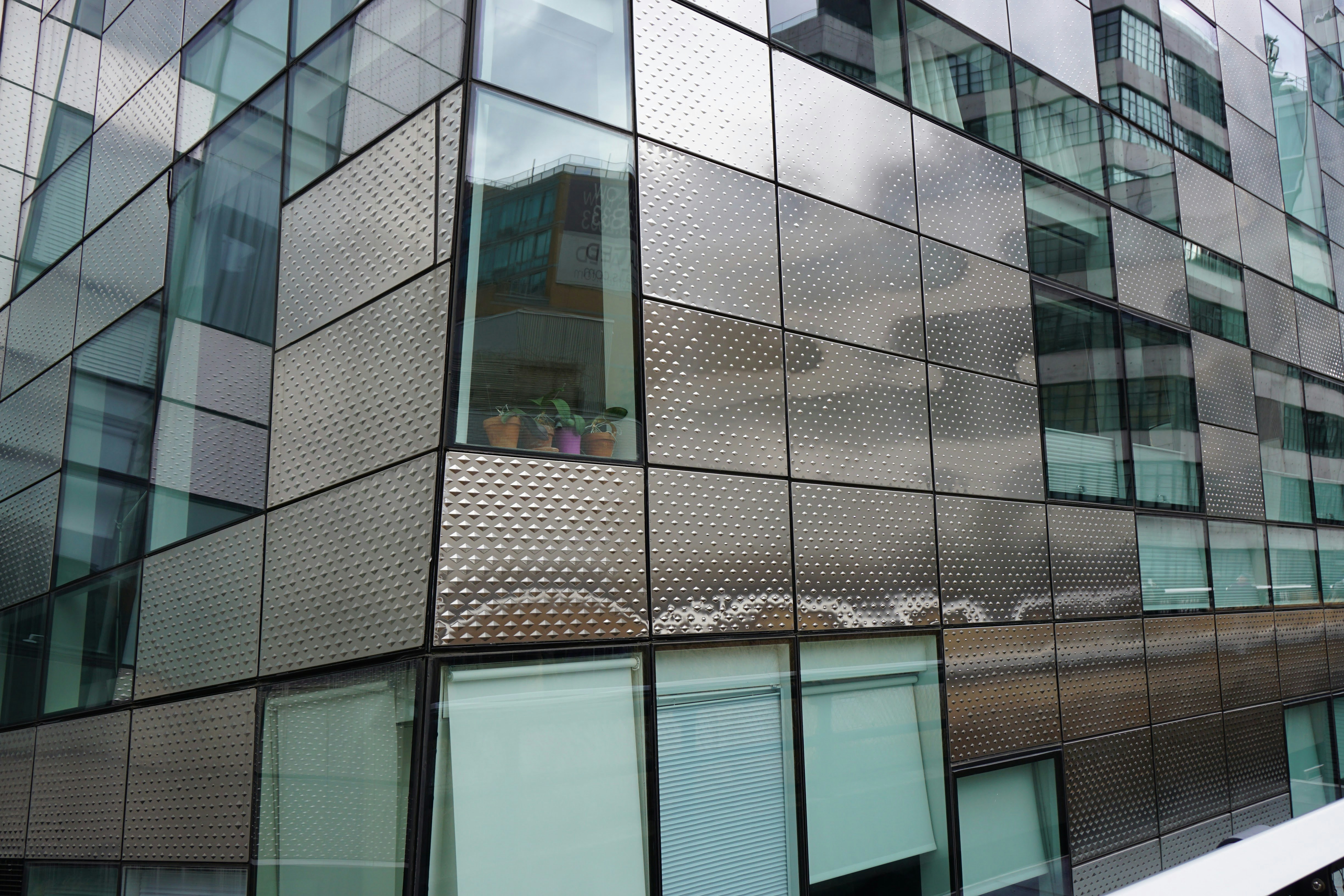 A very tall building with lots of windows photo – Free Building Image ...
