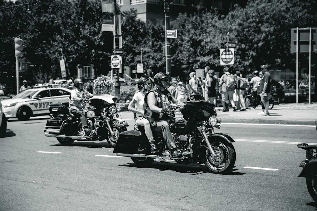 people and motorist at the street