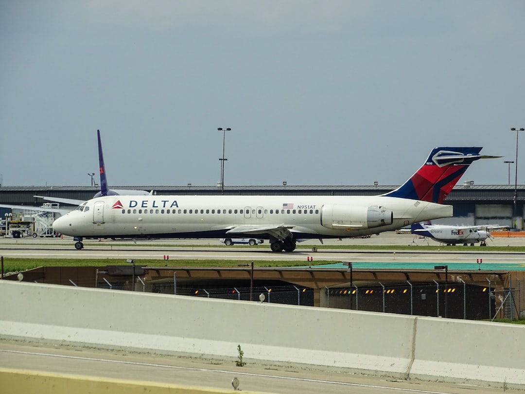 white Delta on airport,