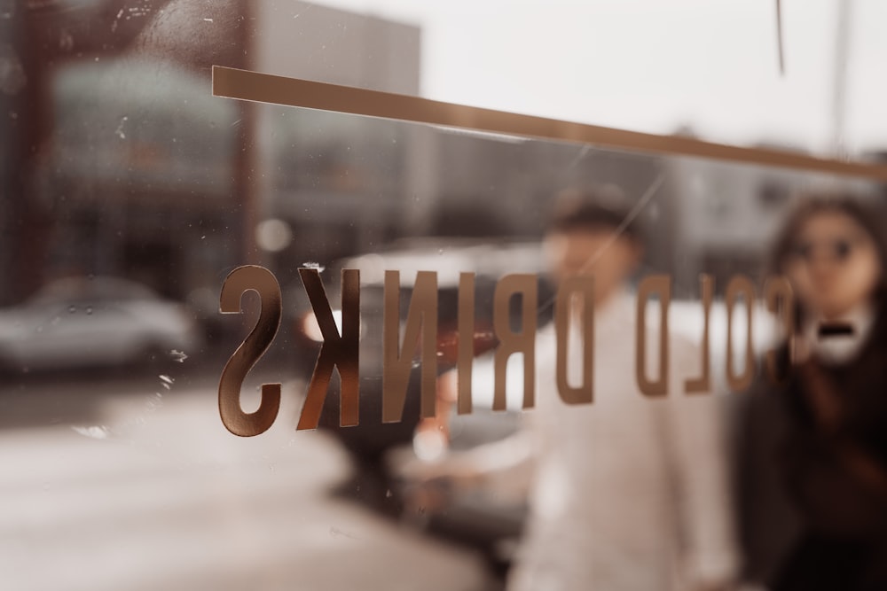 a sign that reads cold drinks on a window