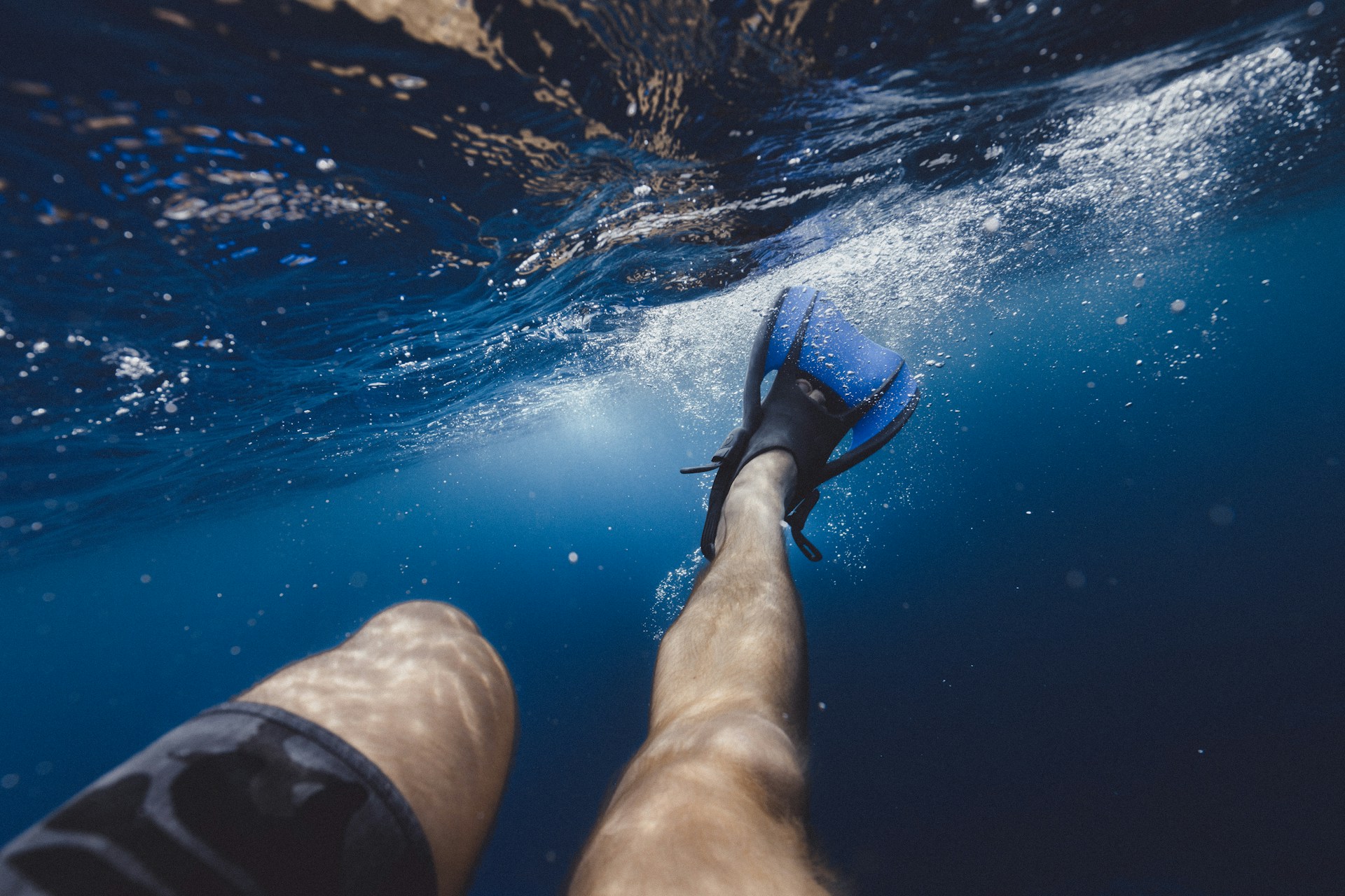 a person's feet are submerged in the water