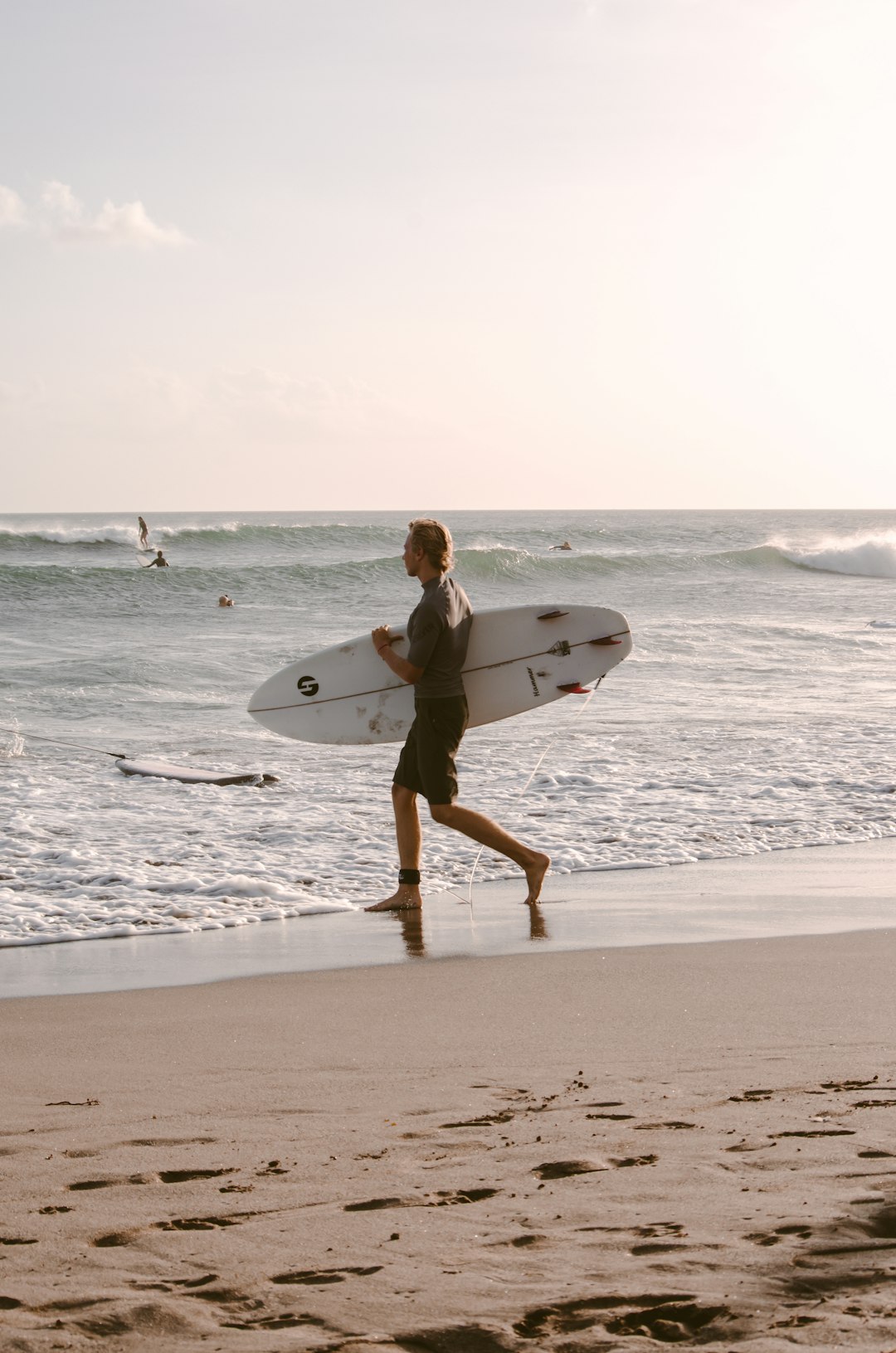 man holding surfboard