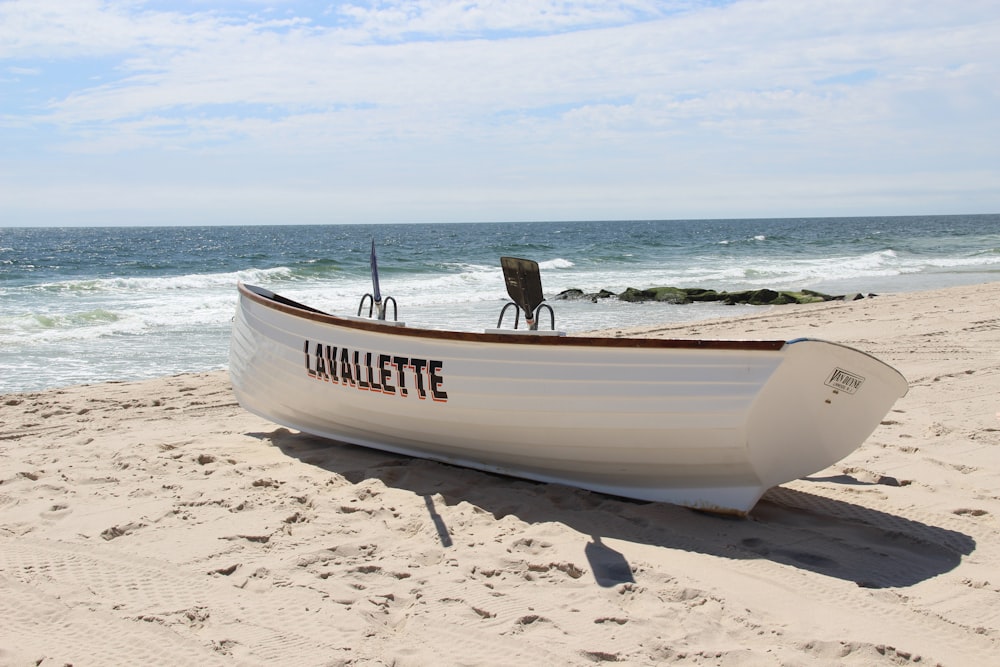 white boat near sea