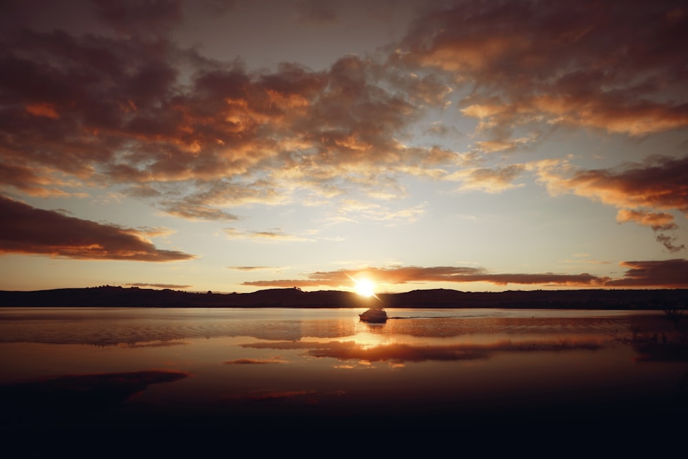 calm body of water during golden hour