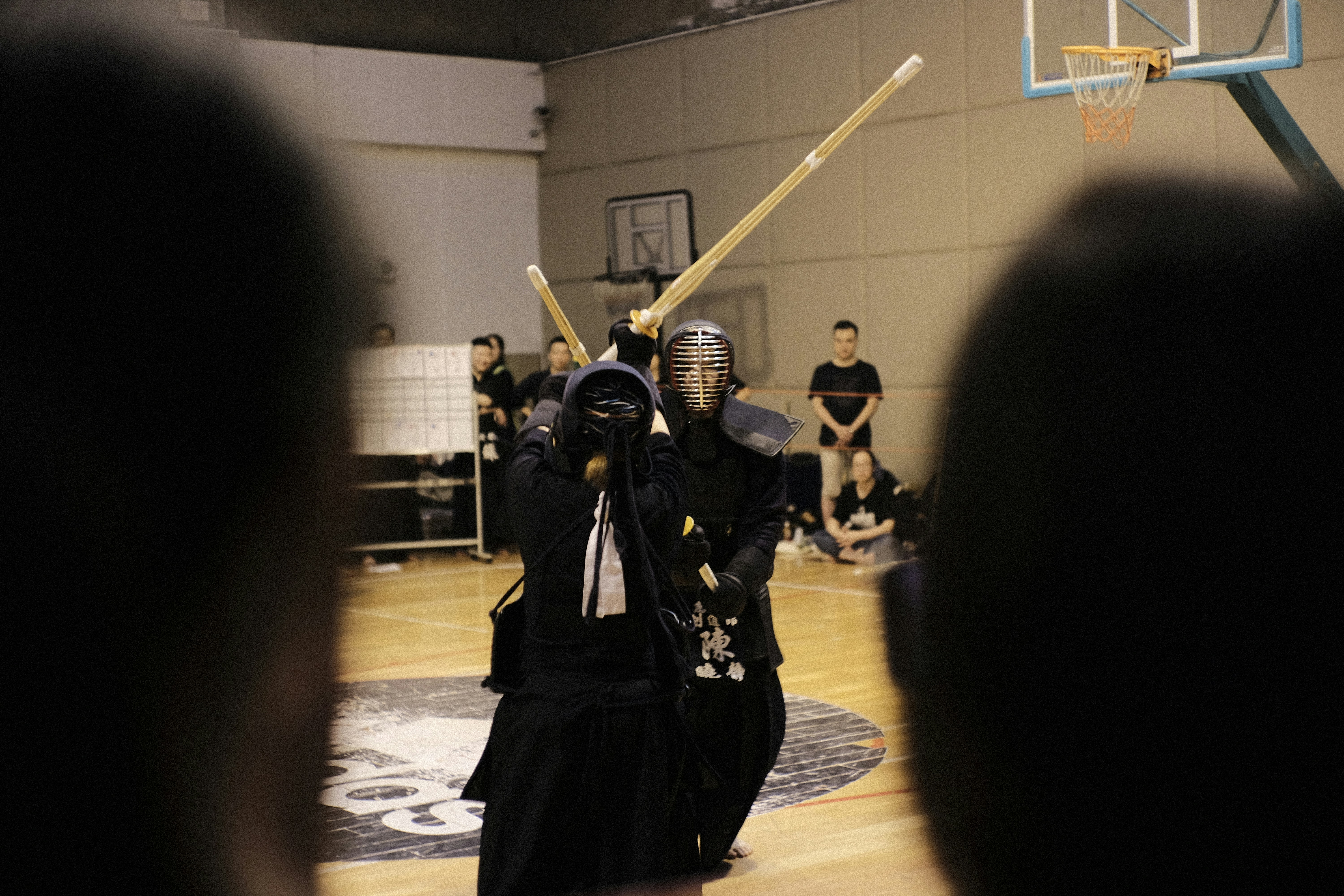 kendo practitioners sparring with bamboo shinai
